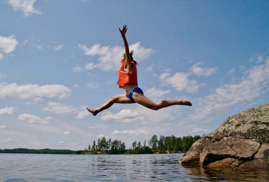 Person jumps with life jacket into the sea