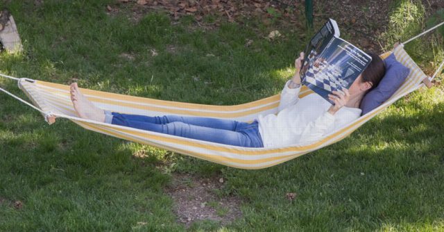 person working in hammock