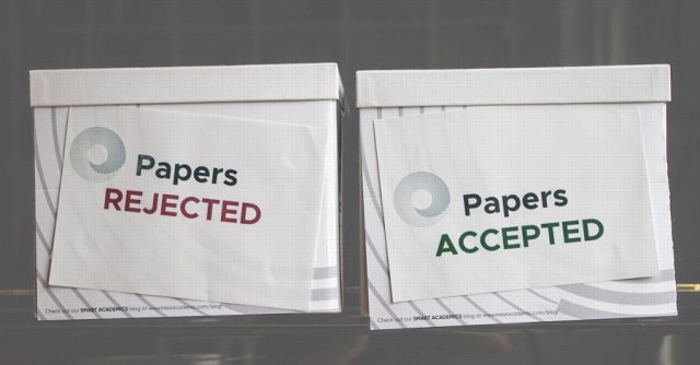 Two boxes with rejected and acceopted papers